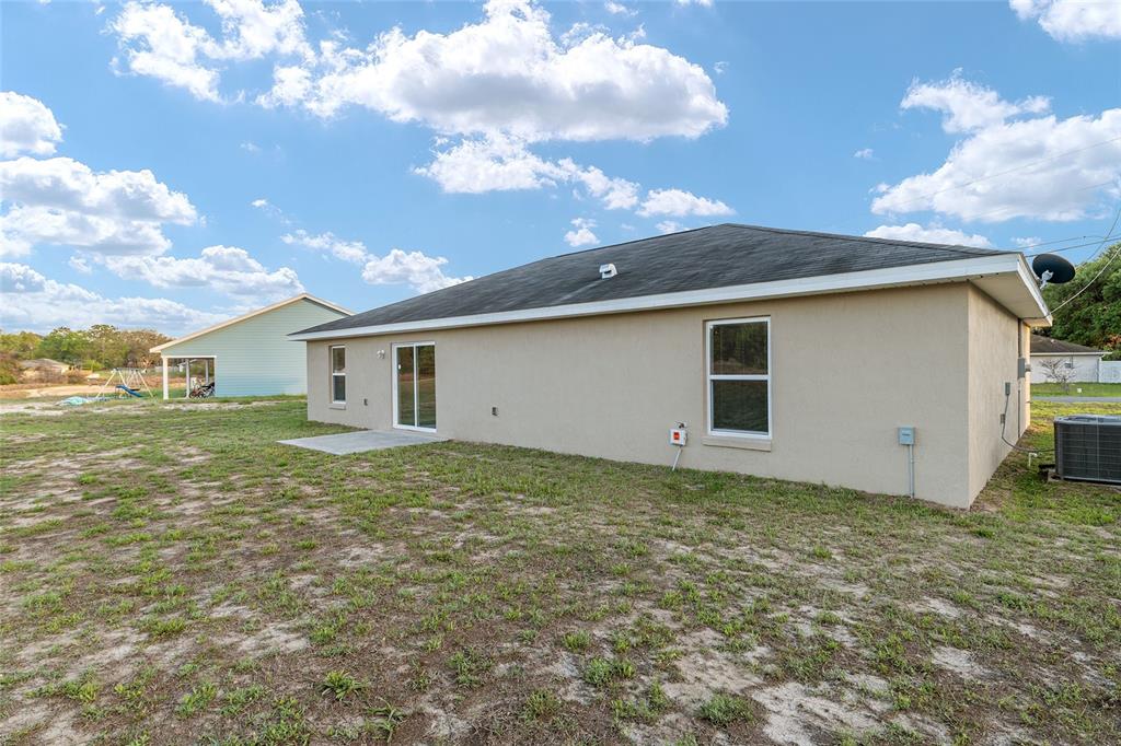 71 Juniper Trail Loop Ocala, FL 34480 - Photo 52 of 58 a view of a house with a backyard