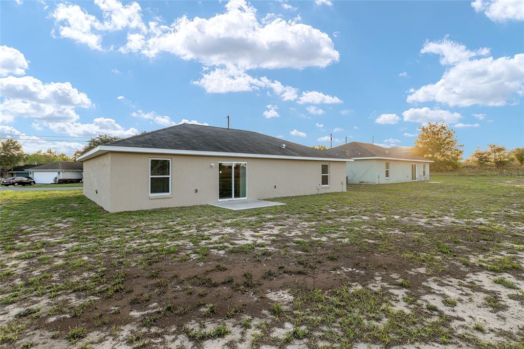 71 Juniper Trail Loop Ocala, FL 34480 - Photo 54 of 58 a view of a house with a yard