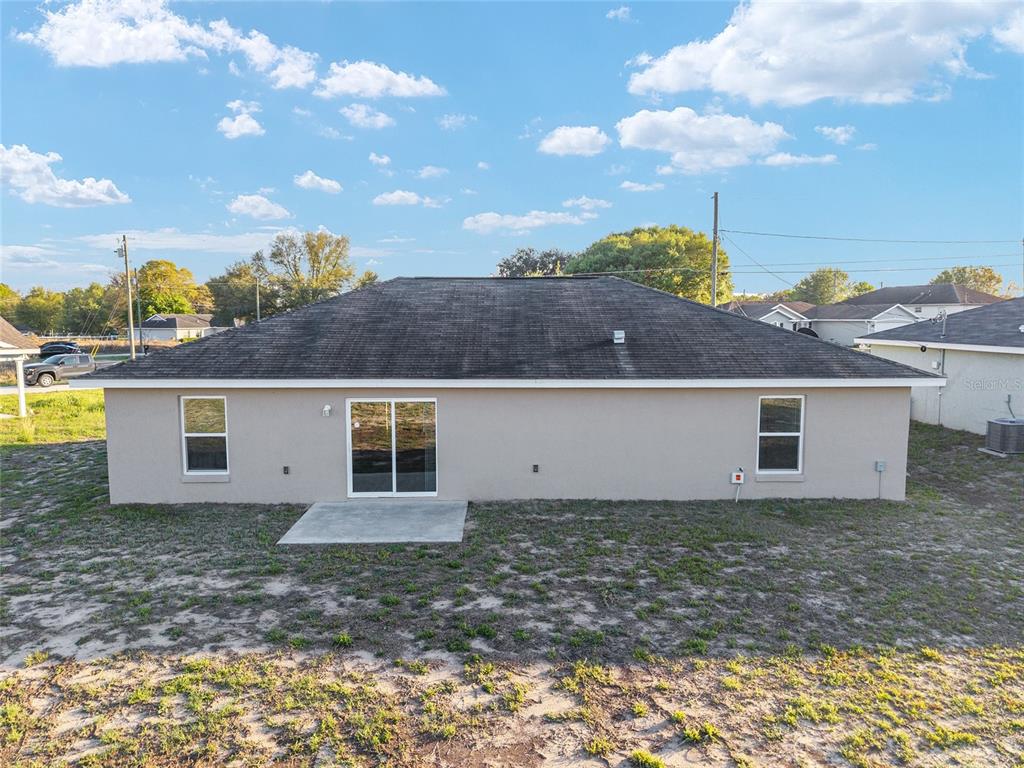71 Juniper Trail Loop Ocala, FL 34480 - Photo 55 of 58 front view of a house with a yard