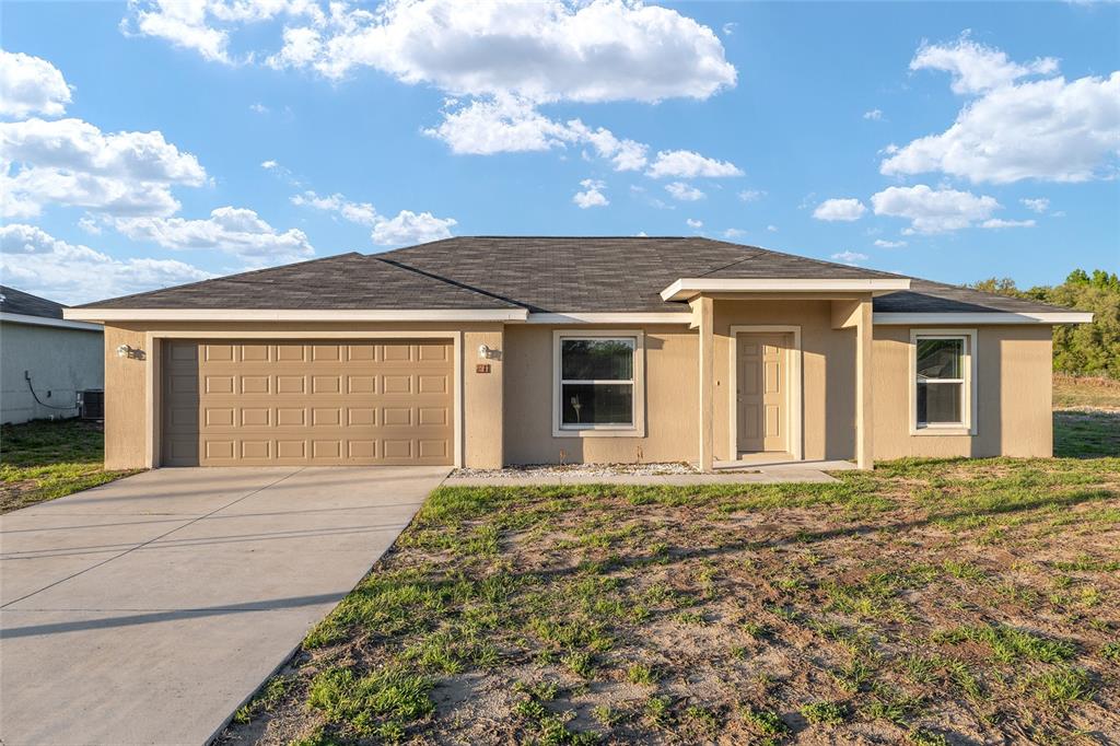 71 Juniper Trail Loop Ocala, FL 34480 - Photo 8 of 58 front view of a house with a large windows