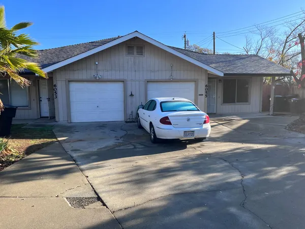 a car parked in front of a house