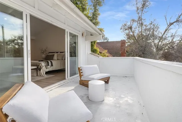a view of balcony with patio
