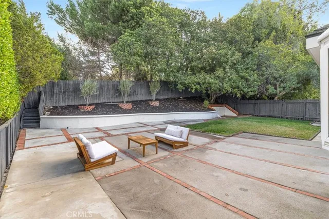 a view of a backyard with a sitting area