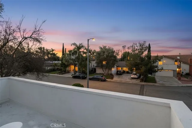 a view of a street with a building in the background