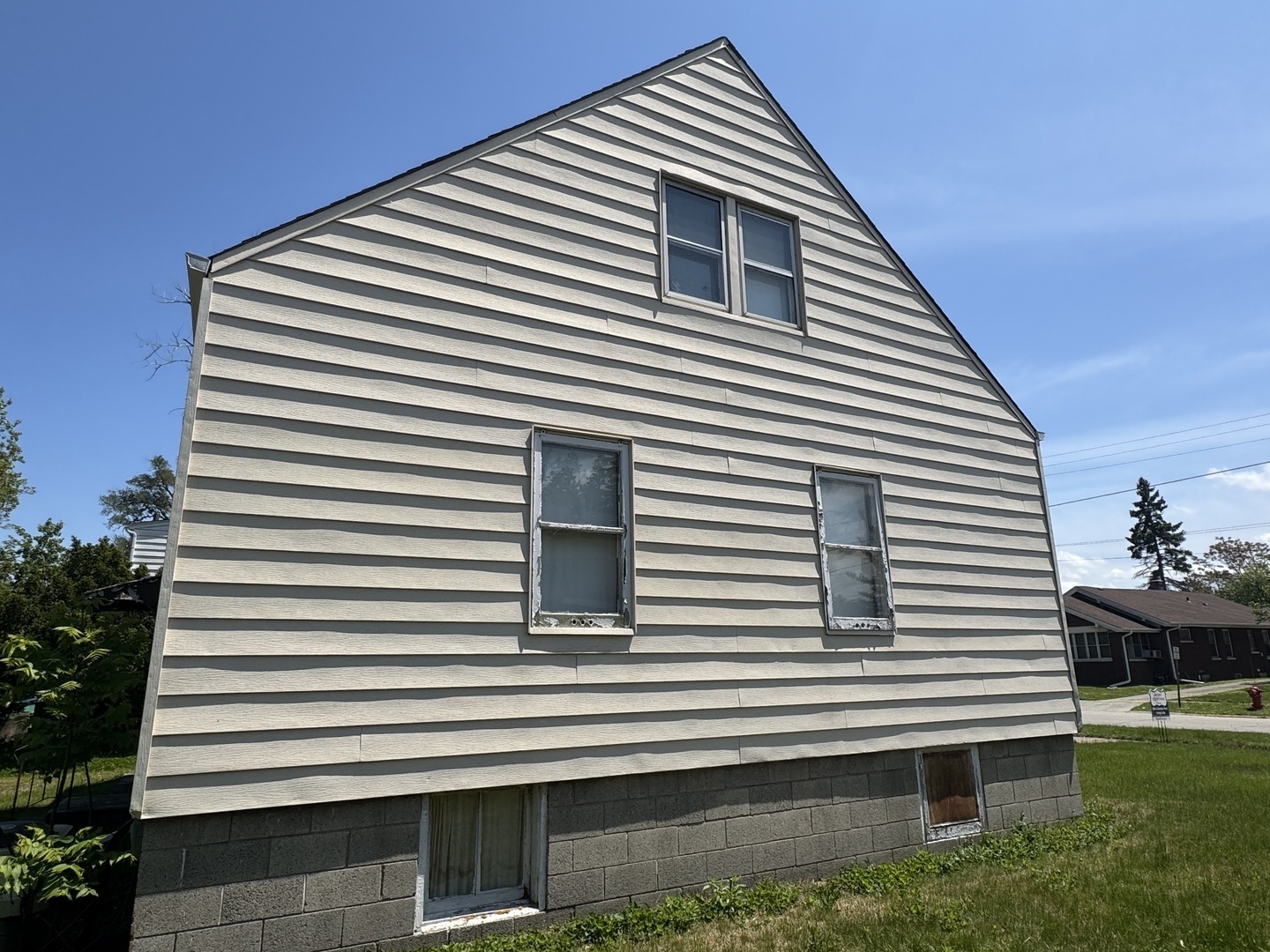 3226 181st Street Lansing, IL 60438 - Photo 18 of 38 a front view of a house with a yard