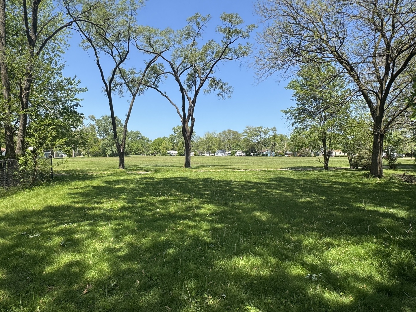 3226 181st Street Lansing, IL 60438 - Photo 25 of 38 a view of a grassy field with trees