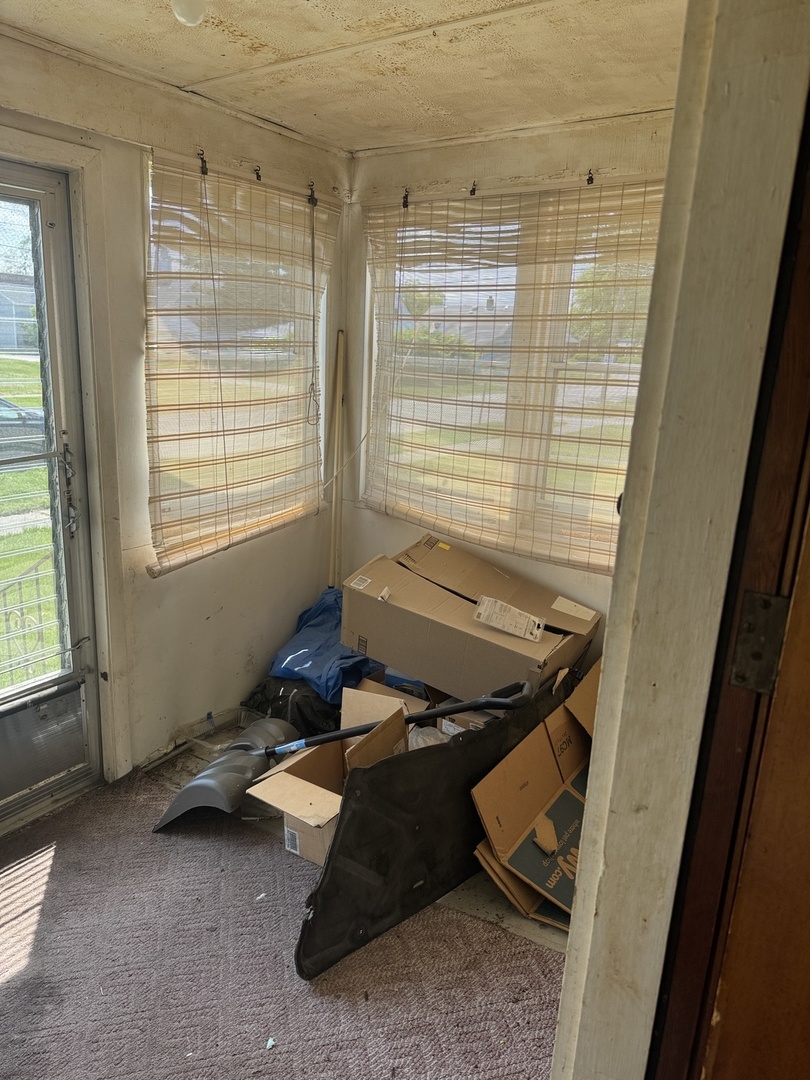 3226 181st Street Lansing, IL 60438 - Photo 28 of 38 a bedroom with furniture and a window
