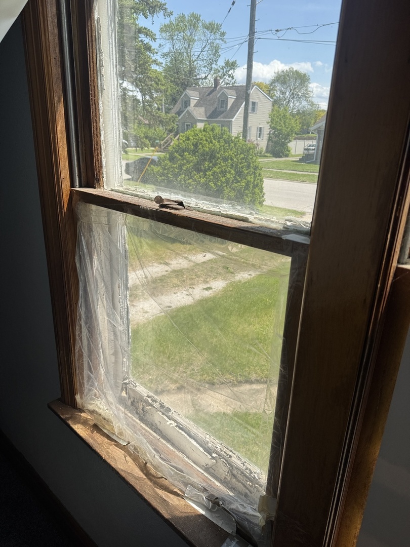 3226 181st Street Lansing, IL 60438 - Photo 29 of 38 a view of a glass door with a yard from a window
