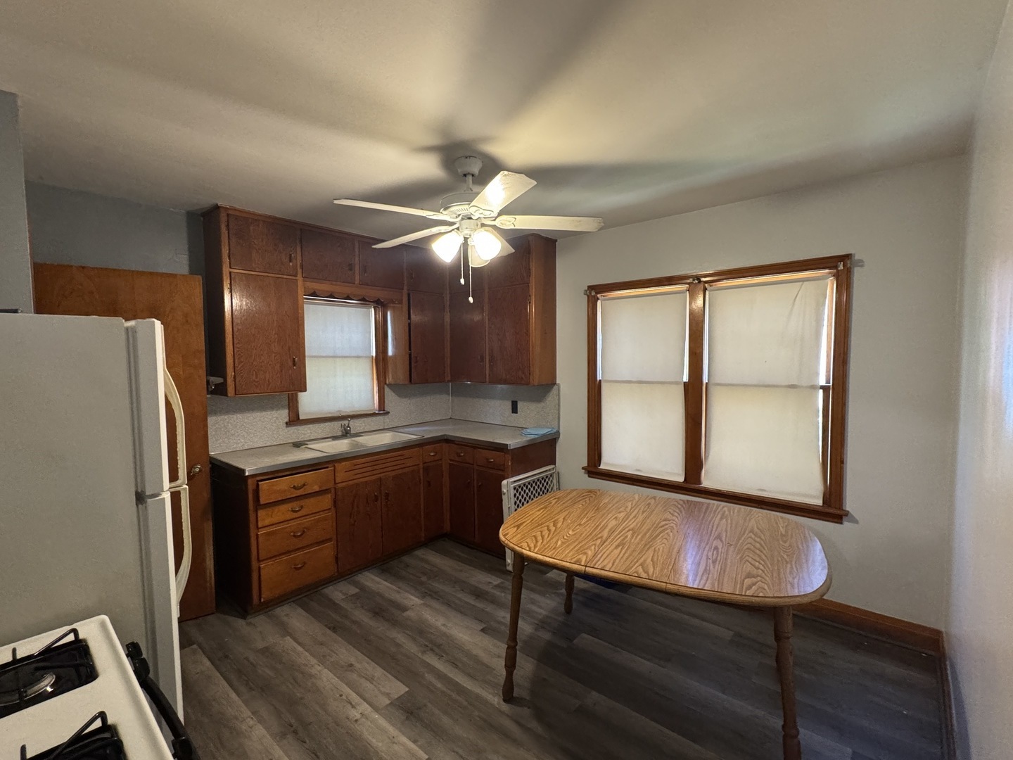 3226 181st Street Lansing, IL 60438 - Photo 4 of 38 a kitchen with stainless steel appliances granite countertop a sink refrigerator and cabinets