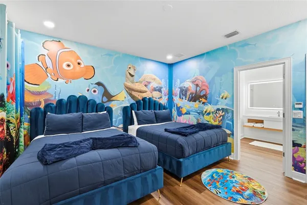 a living room with furniture and painting on the wall