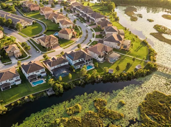 an aerial view of residential houses with outdoor space