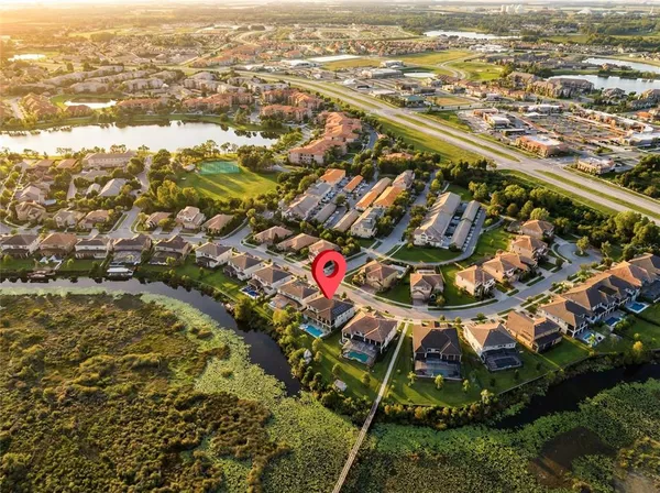 an aerial view of residential houses with outdoor space