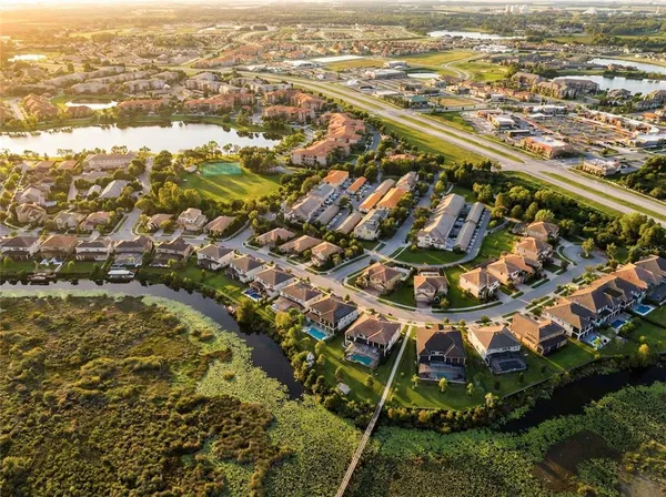 an aerial view of residential houses with outdoor space