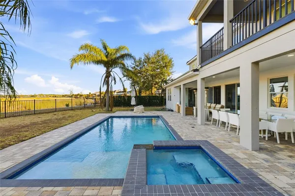 a view of a swimming pool with lounge chair