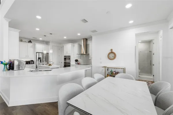 a large bedroom with a bed and window