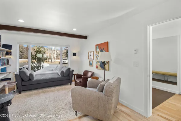 a living room with furniture and a large window