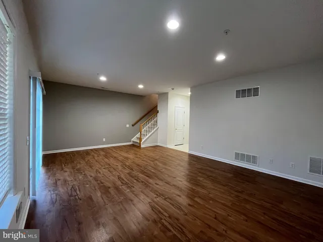 a view of balcony with wooden floor