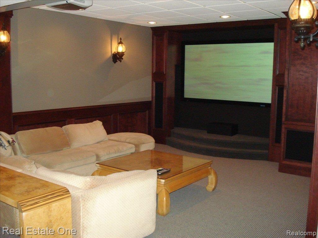 5210 Belmonte Drive, Unit 20 Rochester, MI 48306 - Photo 20 of 25 Basement theatre room with built