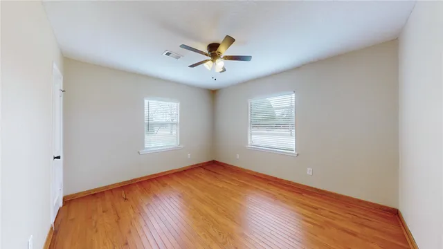 a bathroom with a sink mirror and vanity