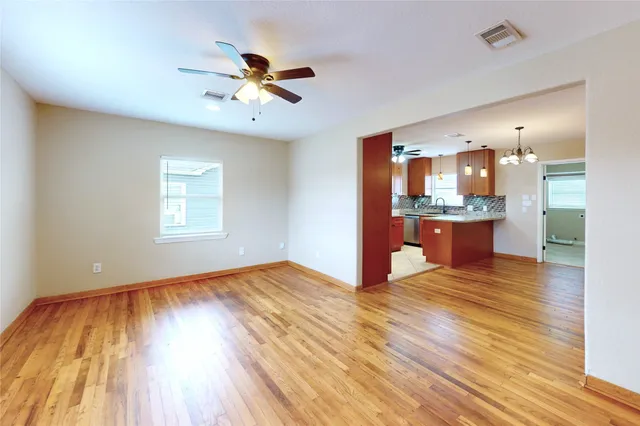 a view of house with backyard