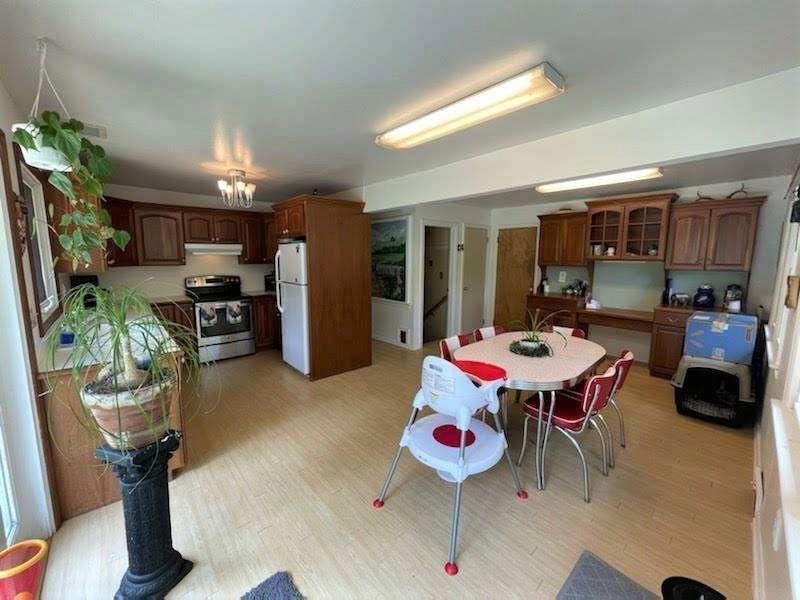 25 Half Mile Road Red Bank, NJ 07701 - Photo 2 of 5 a outdoor dining space with furniture a rug and a chandelier