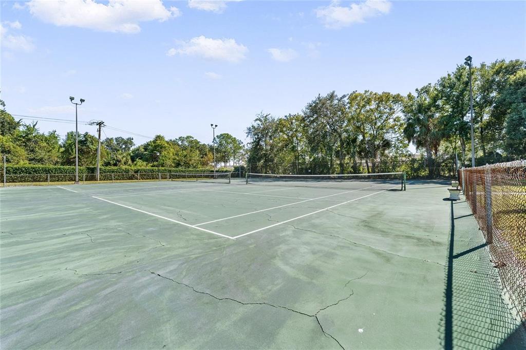 2025 Sylvester Road, Unit N305 Lakeland, FL 33803 - Photo 29 of 34 a view of a tennis court