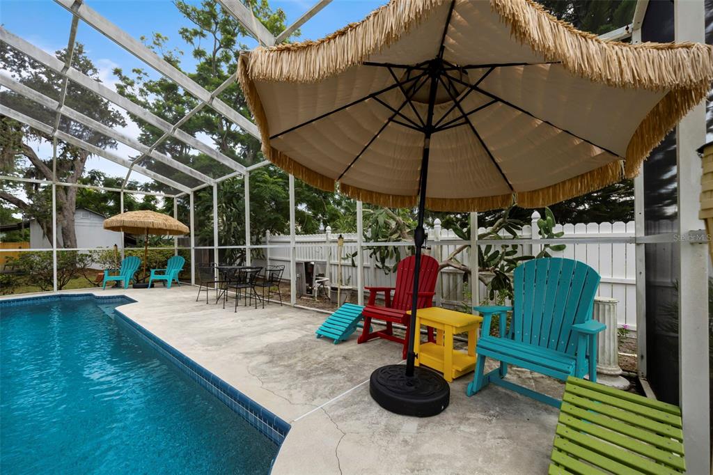 818 Eunice Drive Tarpon Springs, FL 34689 - Photo 31 of 59 a view of a chairs and table in the patio