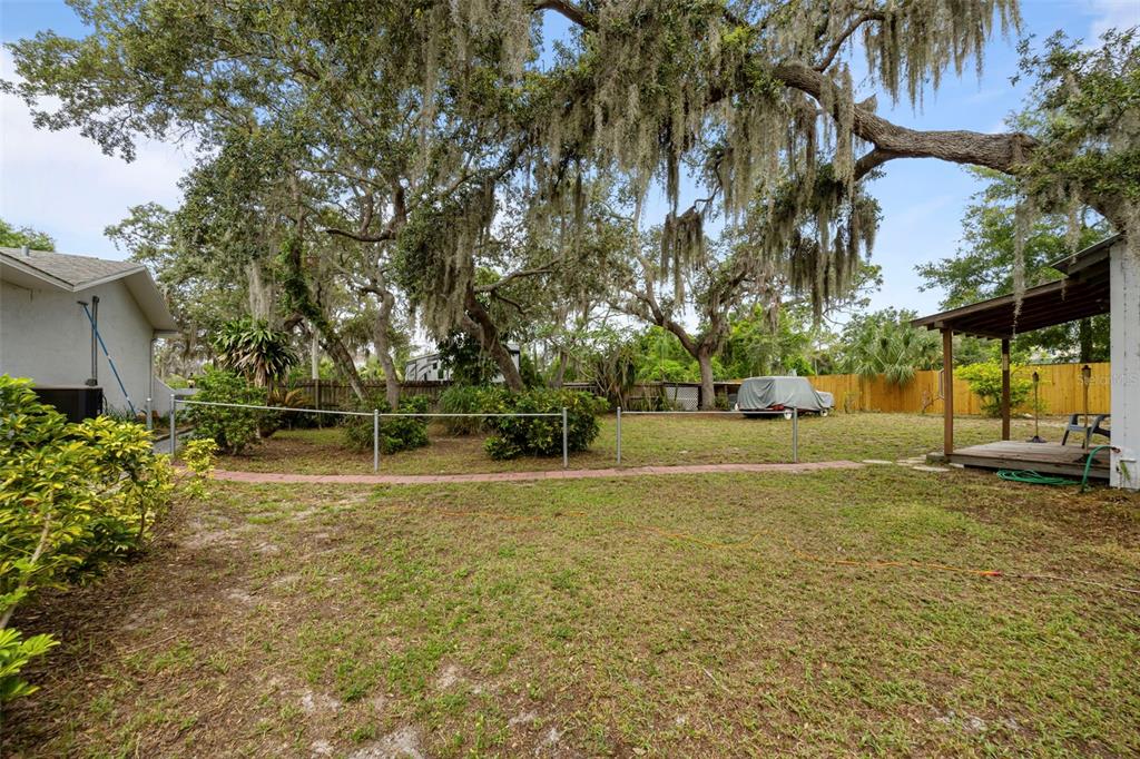 818 Eunice Drive Tarpon Springs, FL 34689 - Photo 36 of 59 a view of a playground with basketball court