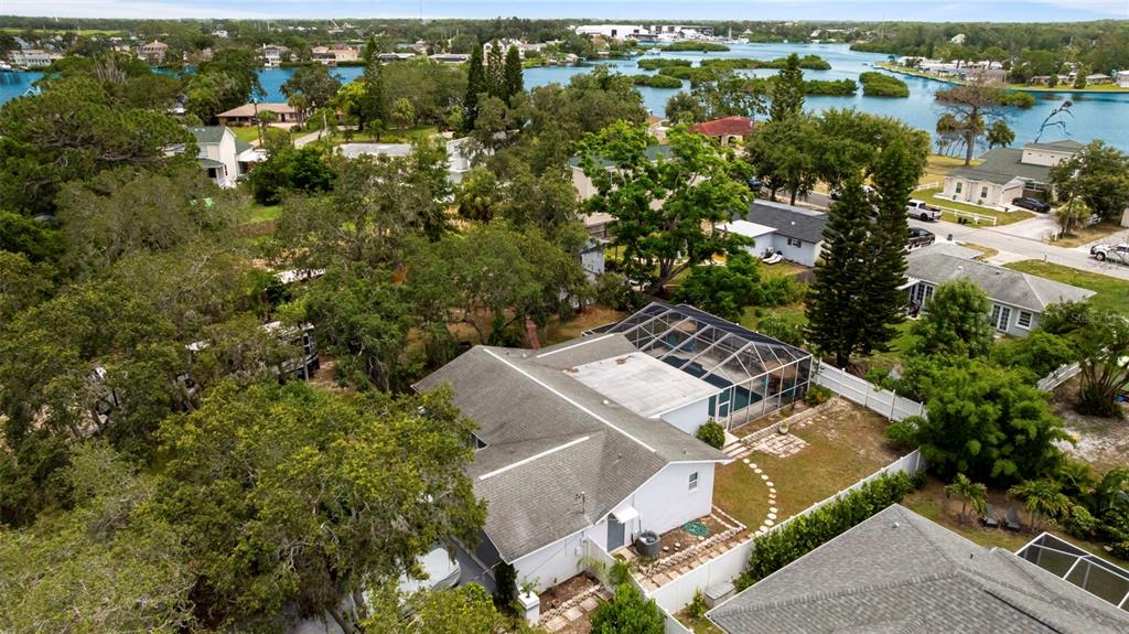 818 Eunice Drive Tarpon Springs, FL 34689 - Photo 49 of 59 an aerial view of residential house with outdoor space and trees all around