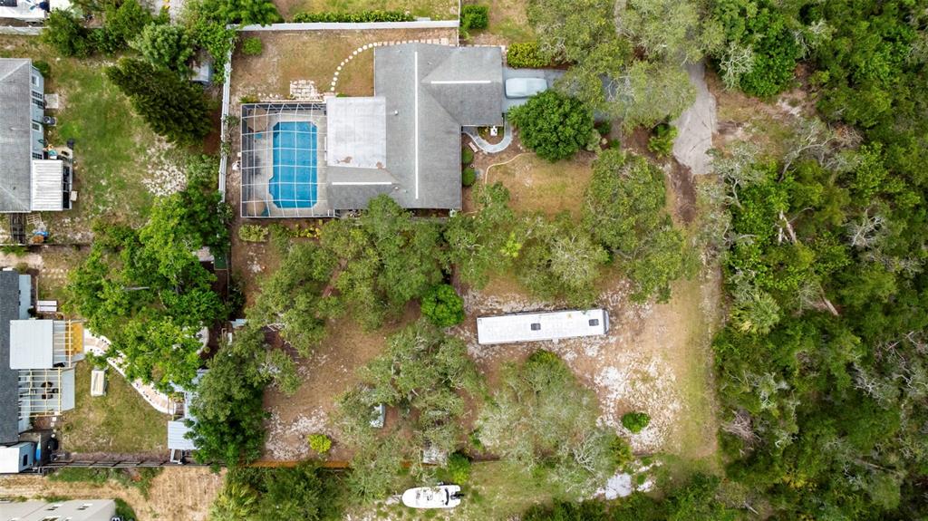 818 Eunice Drive Tarpon Springs, FL 34689 - Photo 52 of 59 an aerial view of residential house with outdoor space and trees around