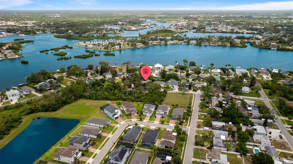 818 Eunice Drive Tarpon Springs, FL 34689 - Photo 54 of 59 an aerial view of river residential house with outdoor space