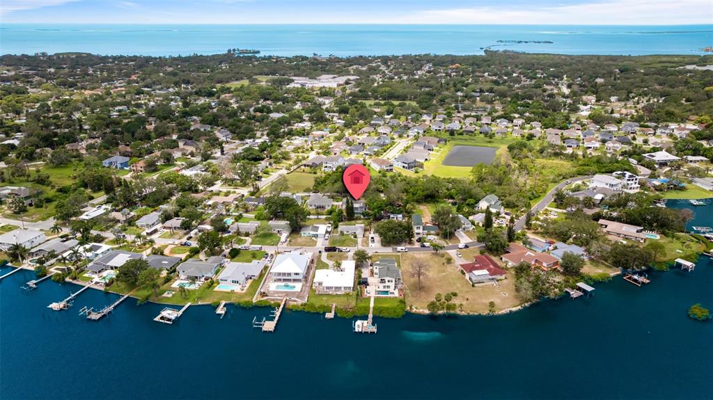 818 Eunice Drive Tarpon Springs, FL 34689 - Photo 56 of 59 an aerial view of residential houses with outdoor space