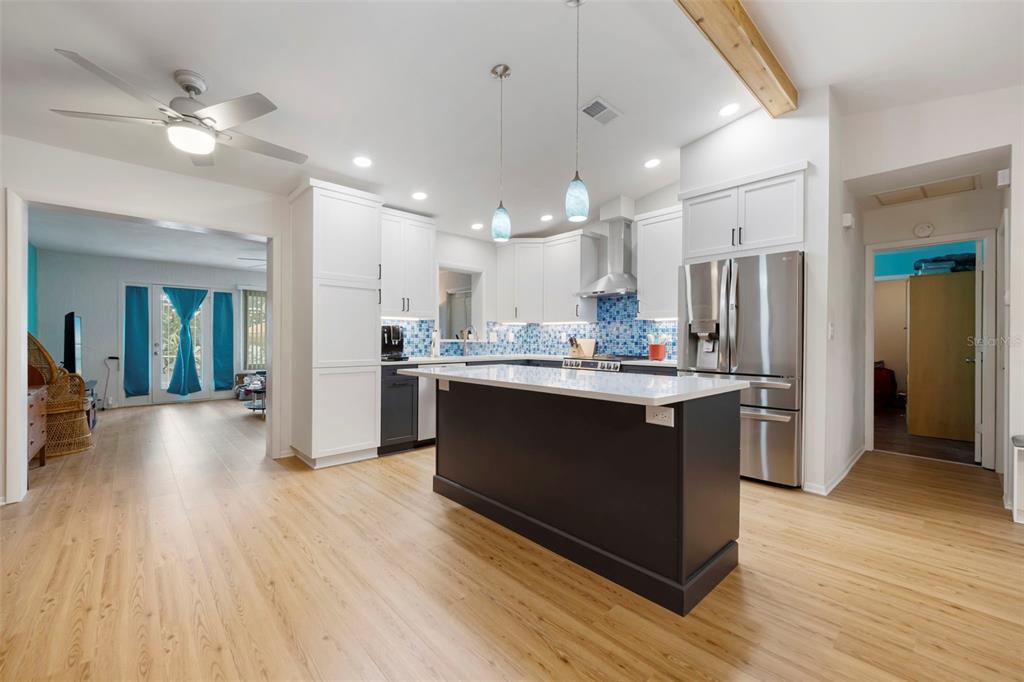 818 Eunice Drive Tarpon Springs, FL 34689 - Photo 10 of 59 a kitchen with a refrigerator and a sink