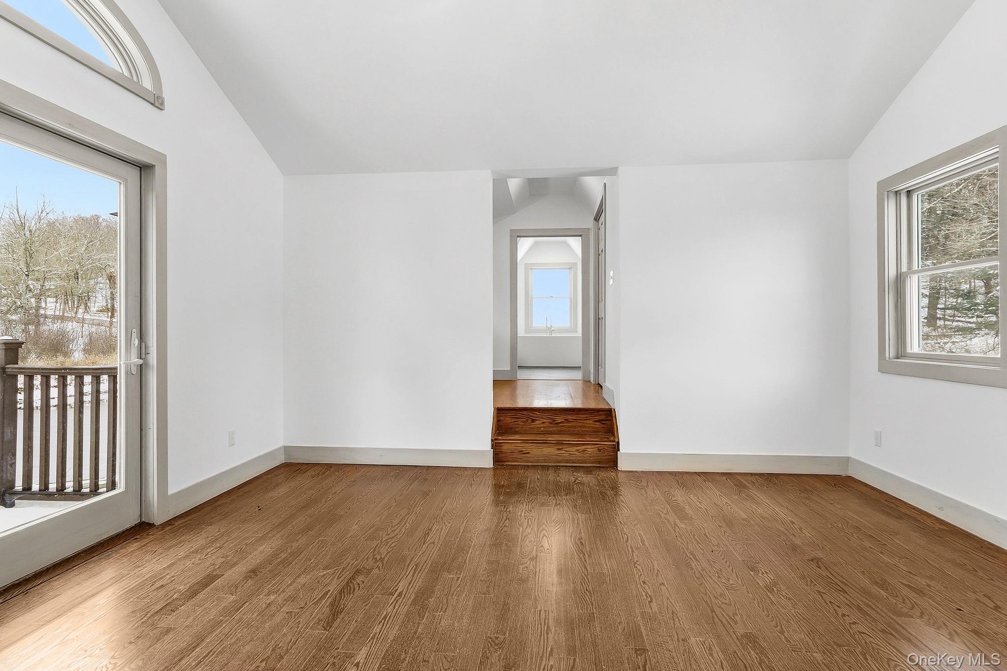 344 Schultz Hill Road Rhinebeck, NY 12572 - Photo 19 of 43 Unfurnished room featuring lofted ceiling and wood finished floors