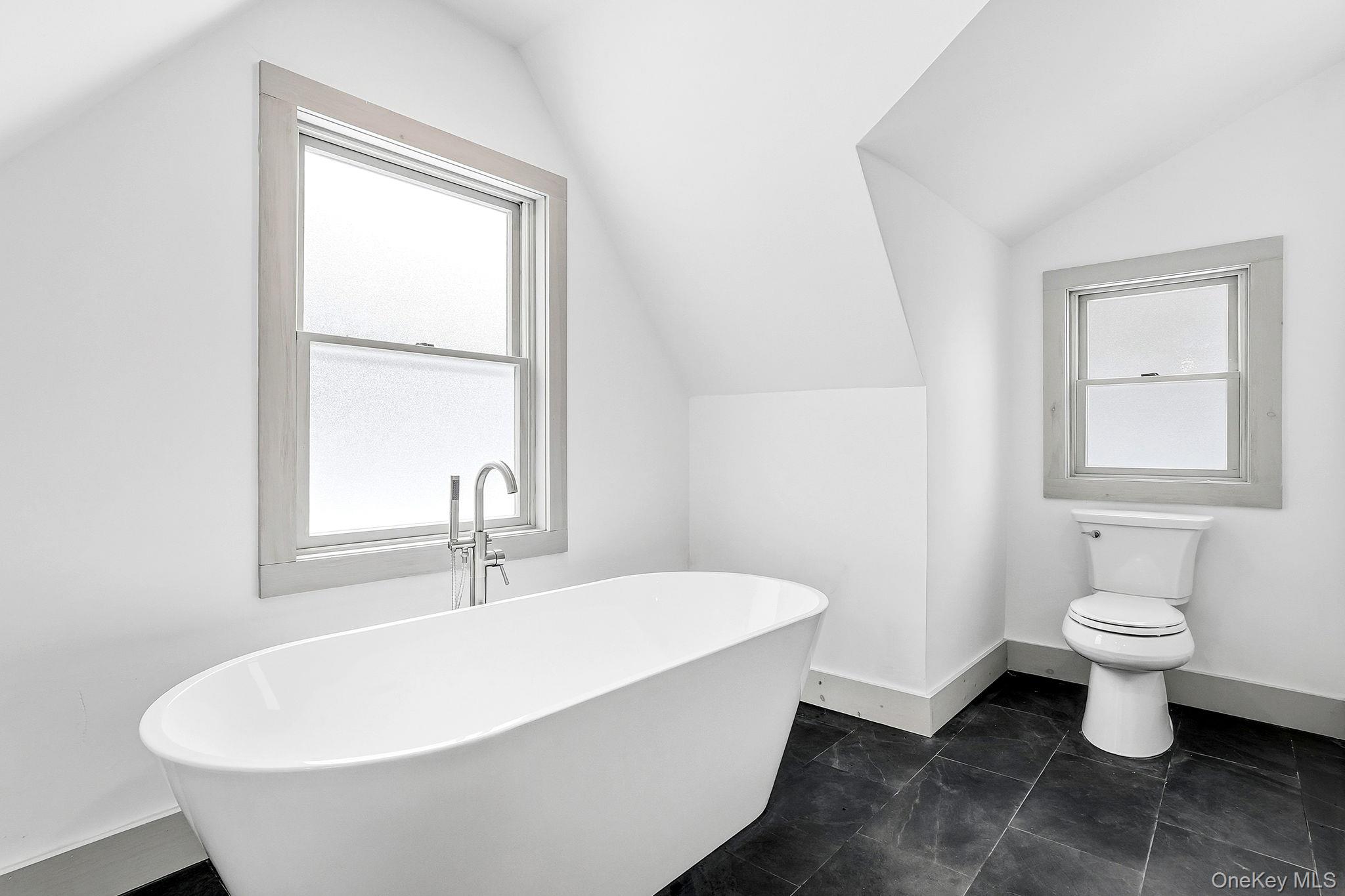 344 Schultz Hill Road Rhinebeck, NY 12572 - Photo 23 of 43 Bathroom with a freestanding tub and vaulted ceiling