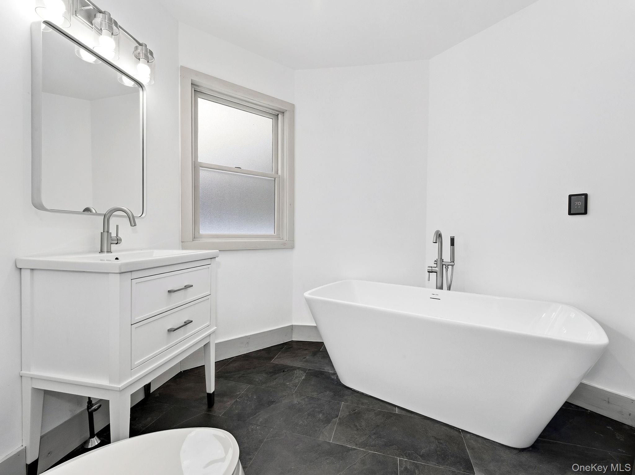 344 Schultz Hill Road Rhinebeck, NY 12572 - Photo 29 of 43 Bathroom with a freestanding tub and vanity