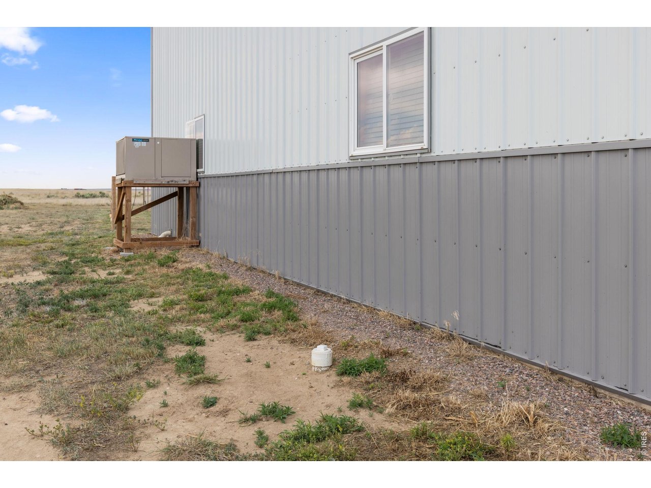 13550 Deter-Winters Road Byers, CO 80103 - Photo 23 of 50 The large capacity wall air conditioner in this picture cools the barn effectively when needed. Also included in this picture is one of several RV dump stations on the property