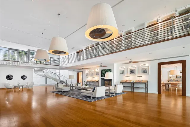 a swimming pool with outdoor seating and a garden