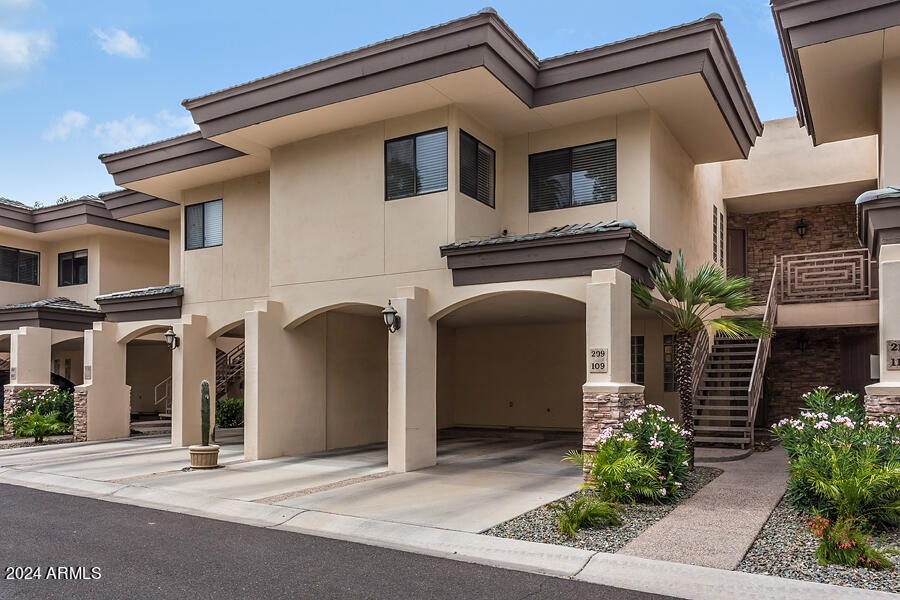 3235 East Camelback Road, Unit 109 Phoenix, AZ 85018 - Photo 1 of 20 a front view of a house with a garage