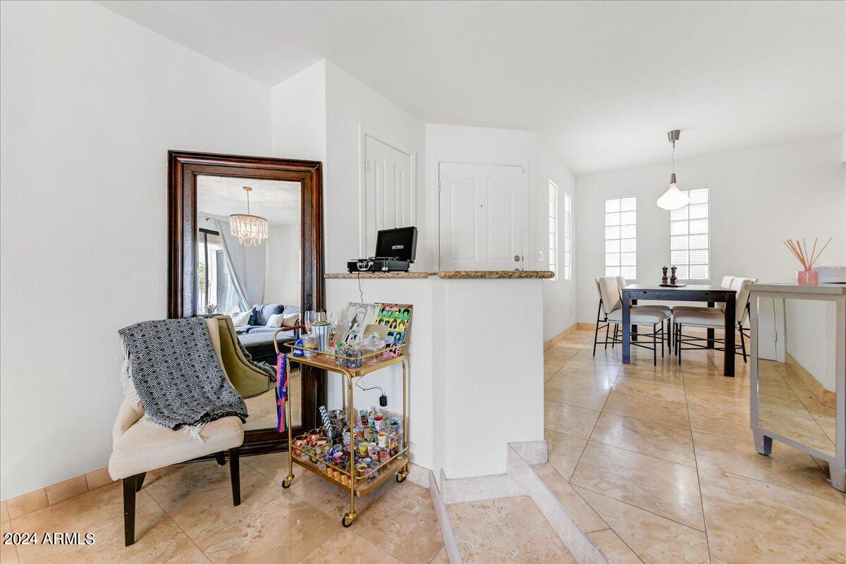 3235 East Camelback Road, Unit 109 Phoenix, AZ 85018 - Photo 5 of 20 a living room with furniture and a piano