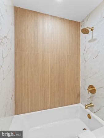 a bathroom with a shower and a tub
