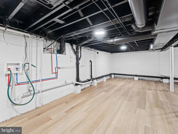a view of a room with wooden floor