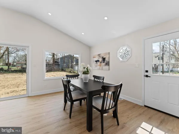 a view of a dining room with furniture and window