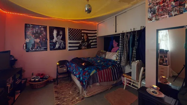 a bed room with a bed and a window