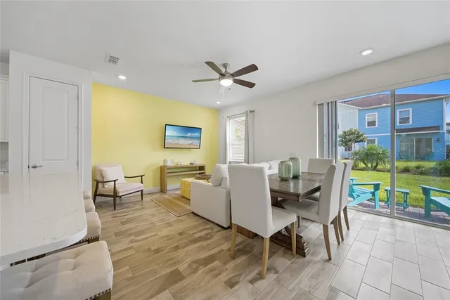 a view of a chair and table in backyard of the house