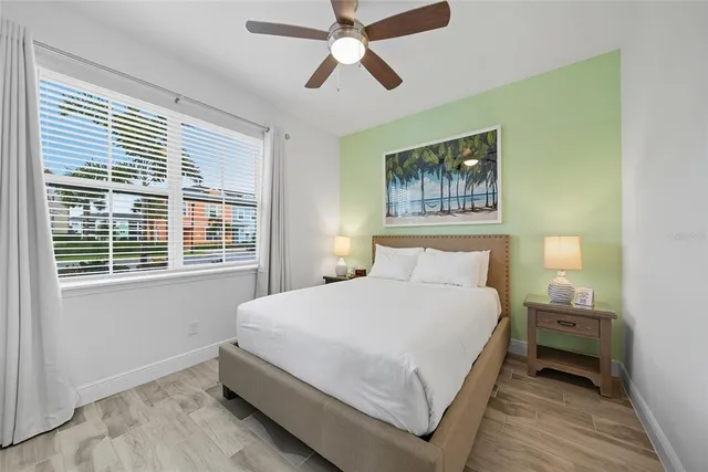 a bedroom with a bed and a window