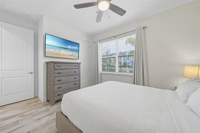 a bathroom with a shower sink vanity mirror and toilet