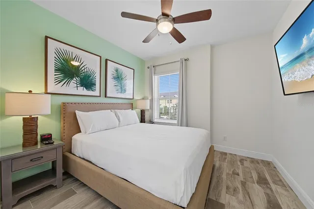 a bed sitting in a bedroom next to a window