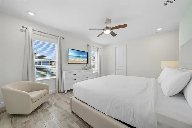a bathroom with a double vanity sink toilet and shower