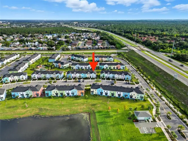 an aerial view of residential houses with outdoor space